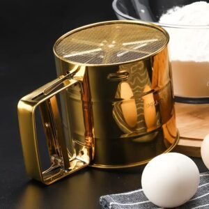 Upgrade your baking with our luxury golden stainless steel flour sifter. Features an easy squeeze handle, ultra-fine mesh, and mess-free cup design. Shop now!